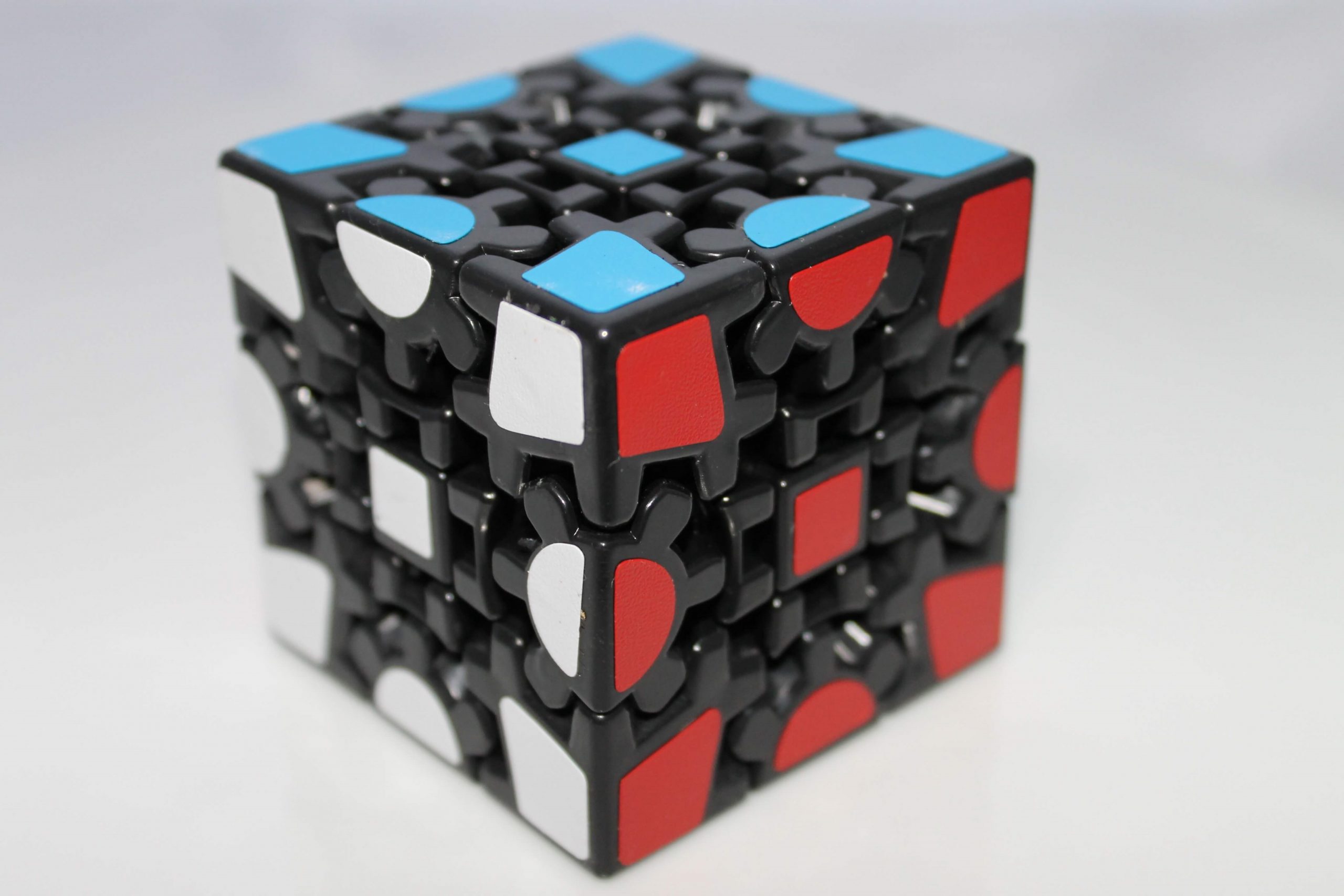 assorted challenging rubiks cubes | White Alpaca